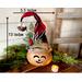 This is a handmade Christmas elf made with a real dried gourd. Including his elf hat, he is 13 inches tall and 5.5 inches wide. 